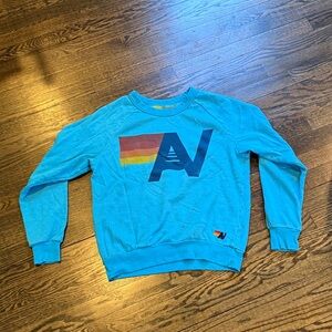 Aviator Nation Turquoise Crewneck with Navy Retro 'A' and Warm Stripe
